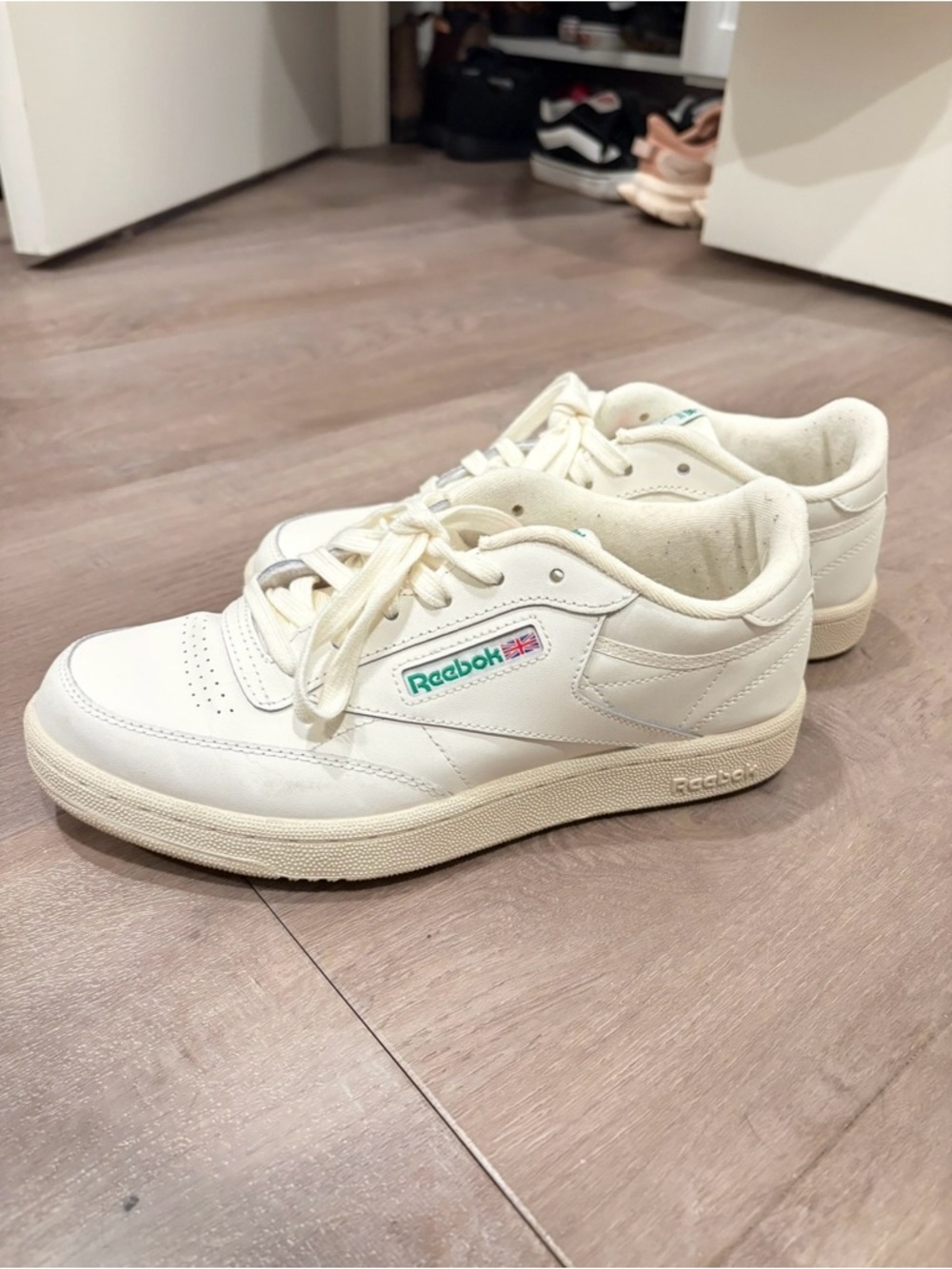 Reebok women’s Off-White Leather Low-Top Sneakers with Teal Logo